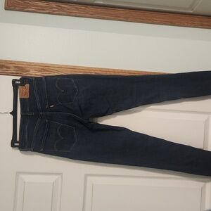 Womens levi jeans size 26 dark blue in color